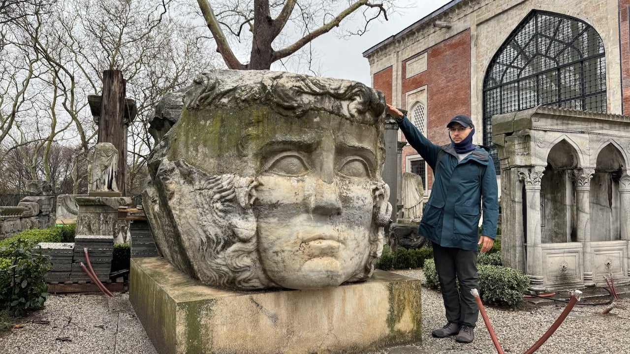 Rick beside a colossal Gorgon head, Istanbul Archaeology Museums